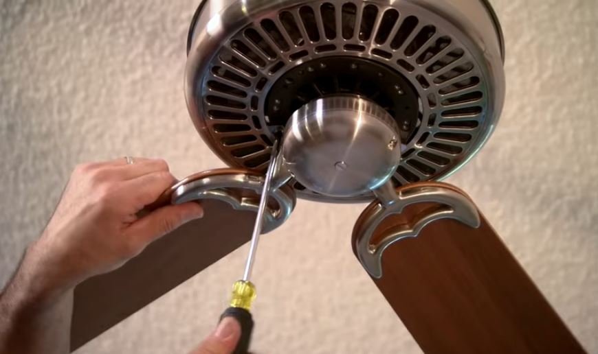 Technician diagnosing a ceiling fan wiring issue in Broken Arrow, OK